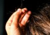 Mulher é espancada e tem parte do cabelo arrancado por dívida em compras de roupas
